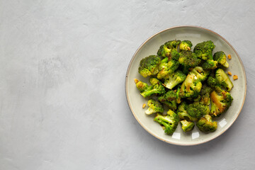 Homemade Pan-Fried Broccoli on a Plate, top view. Flat lay, overhead, from above. Space for text.