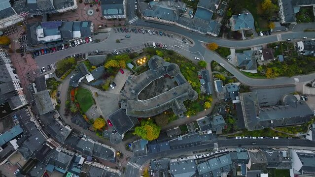 Aerial drone Shot in Clervaux castle on the north of Luxembourg. Twilight evening scene with top view bird eye