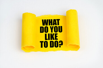 On a white surface, a yellow scroll of paper with the inscription - WHAT DO YOU LIKE TO DO
