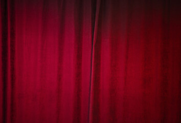Building of theatre indoor with red closed velvet curtain in which plays and other dramatic performances are given