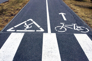 Signs  of Bicycle Lane and Pedestrian Path and Crosswalk Zebra.