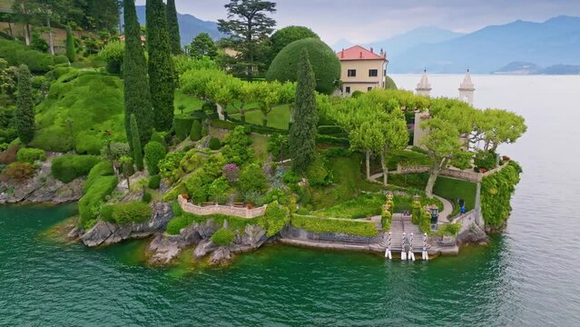 Aerial view of Villa del Balbianello, Lake Como, Italy. Beautiful garden and villa on lake. Tremezzina, Como Lake, Lombardy, Italy. 4K UHD
