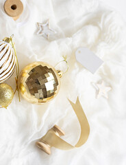 Christmas celebration concept composition with golden and white decoration on the table. Close up