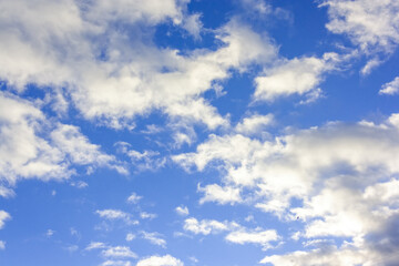 Summer evening sky in the picturesque clouds, lit by the rays of the setting sun.