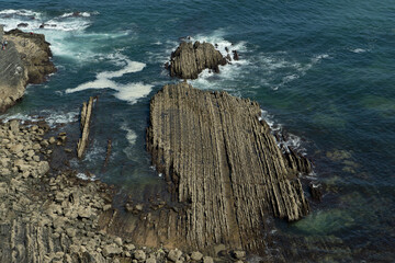 waves breaking on the rocks