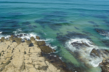 waves breaking on the rocks