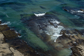 waves breaking on the rocks