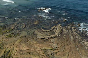 waves breaking on the rocks