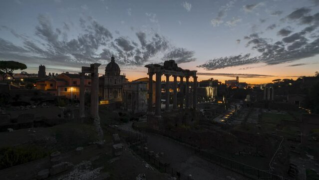 Timelapse of Roman forum with illuminated ancient structures during stunning sunrise