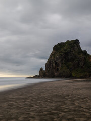 Fototapeta na wymiar Coastline view of Piha Beach with Lion Rock, Auckland, New Zealand.
