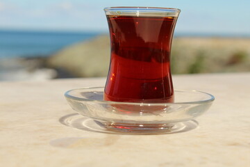 A tiny cup of Turkish black tea in special concept