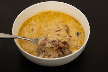 Cheese Burger Soup with ground beef cheese and a white bowl