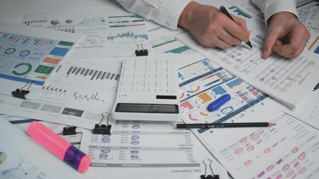 Calculator close up on the auditor's desk tpp view