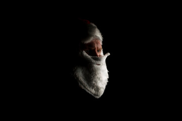 A fake Santa giving a serious look just off camera.