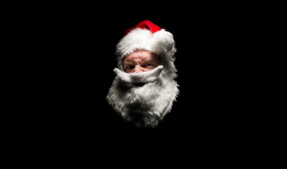 a head shot of an angry looking santa head.