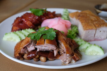 closeup roasted duck with crispy pork