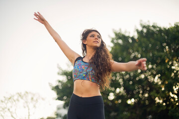 Young woman dancing ballet in the park