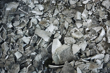 Demolition gravel background. Gray stones texture. Grunge ground after industrial destruction....