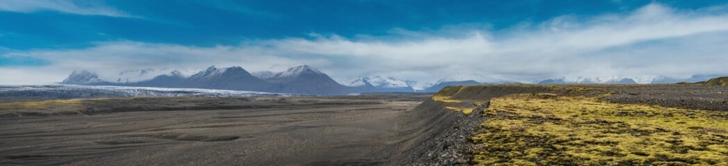 Iceland autumn tundra landscape near Haoldukvisl glacier, Iceland. Glacier tongue slides from the...