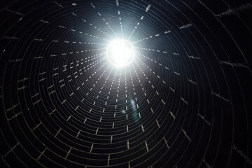 Vertical tubing shaft. Abstract light at the end of tube tunnel