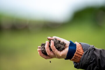 hands holding soil on a farm in australia