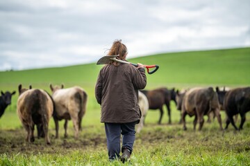 women in agriculture working on a ranch in America. Soil scientist feeling a soil sample. testing...