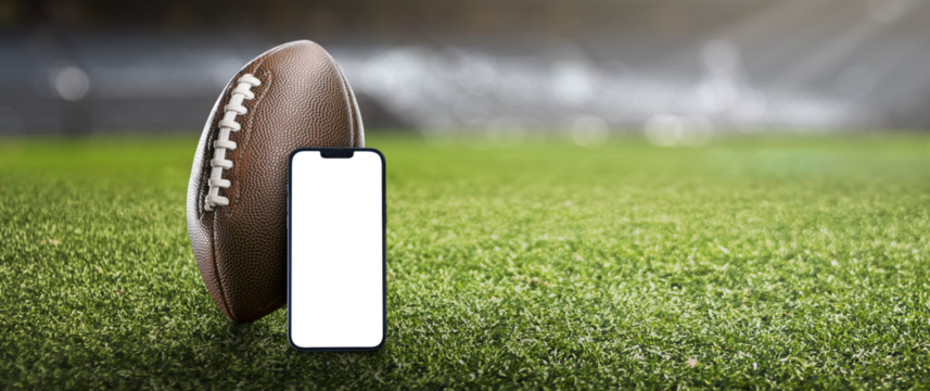 American football ball on the grass of a stadium -  png transparent