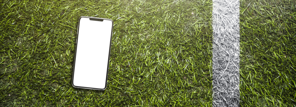 smartphone on the grass of a american football stadium / soccer