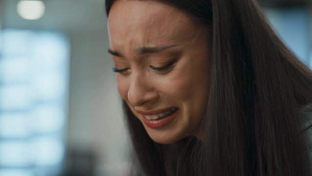 Distressed office woman crying sitting sofa closeup. Professional feeling sad