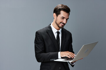 Man business with laptop smile with teeth business talks online internet by video call on gray background. Happiness from cooperation