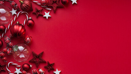 Merry Christmas and Happy New Year banner concept.Close-up red christmas balls,striped lollipops,...