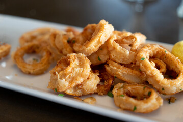 Fried calamari on white plate