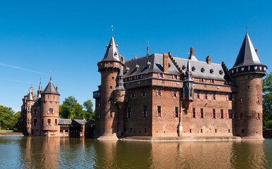 Fototapeta premium Picturesque summer landscape with a view of the ancient Castle De Haar, located near the city of Utrecht, Netherlands