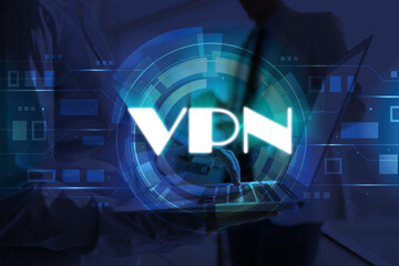 Woman using modern laptop with switched on VPN in office, closeup