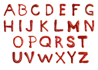 Alphabet made of ketchup on white background