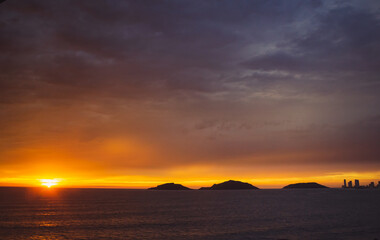 Naklejka na ściany i meble sunset over islands