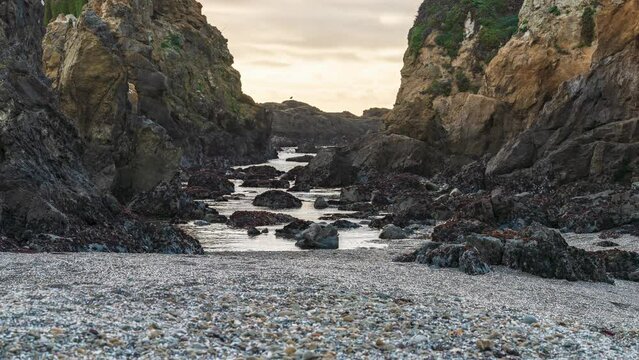 Timelapse of ocean waves between two rocks at Glass Beach, California