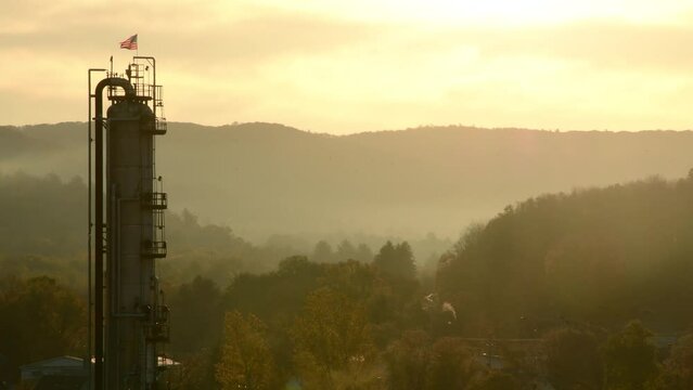 Oil disel fuel refinery tower during stuning sunrise