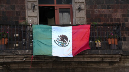 Mexican flag on a building near the Zocalo in Mexico City