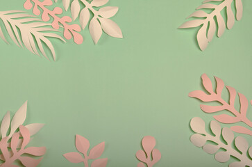 light green background with white and pink sheets of paper