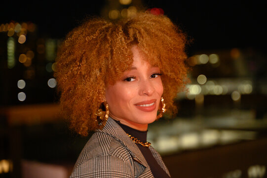Young African-American Woman on LA Roof Top with Blonde Afro