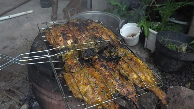Grilled tilapia using a clay stove