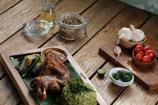 Kampung Fried Chicken With Basil Rice, Served With Urap And Sambal Matah.