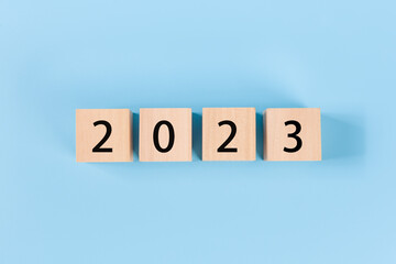  2023 on wooden cubes. New year and holiday concept.