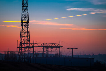 Fototapeta na wymiar relay Cell tower in the early morning against the background of an orange sky