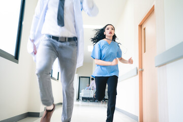 Young male and female professional doctor and surgeon holding clipboard with stethoscope and...
