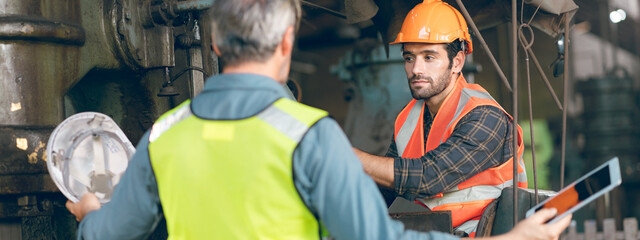 industrial factory with men at work concept, professional engineer foreman inspector talking in...