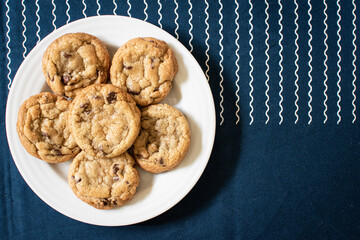 Chocolate chip cookies on a blue table cloth