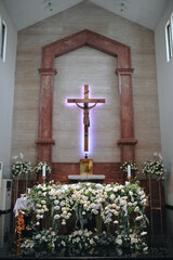 Wedding decoration indoors. Cathedral, church decoration for ceremonial wedding. Grooms and Bride