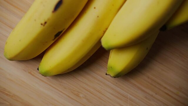 A close up shot of the ends of a bunch of Bananas.